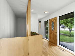 Entrance foyer featuring light wood finished floors and recessed lighting