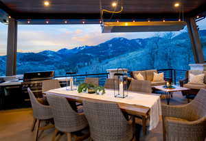 View of patio / terrace with a mountain view, an outdoor living space, grilling area, and exterior kitchen