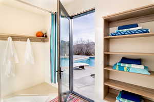 Doorway to outside featuring tile patterned flooring
