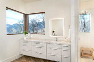Bathroom with vanity and baseboards