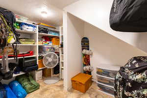 View of basement storage room with built in shelving