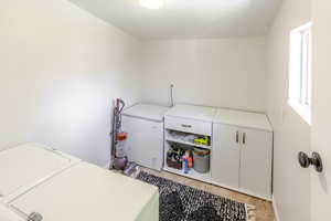 Laundry room featuring independent washer and dryer