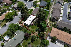 Aerial view of residential area featuring property parcel outlined