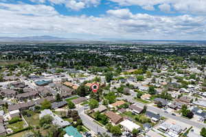 Aerial perspective of suburban area with a mountain backdrop
