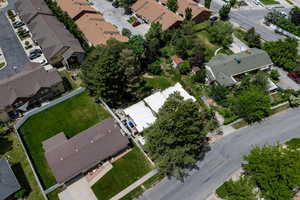 Aerial view of property's location featuring nearby suburban area
