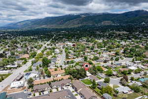 Aerial perspective of suburban area featuring a mountain backdrop