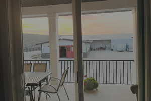 Residence deck overlooking the stable and indoor arena.