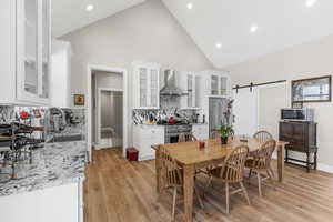 The chef’s kitchen is appointed with a commercial 36-inch gas range, vented hood and a large butler’s pantry.