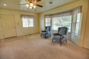 Sitting room featuring carpet flooring, a ceiling fan, baseboards, and recessed lighting