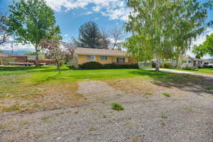 View of front of property with a front yard