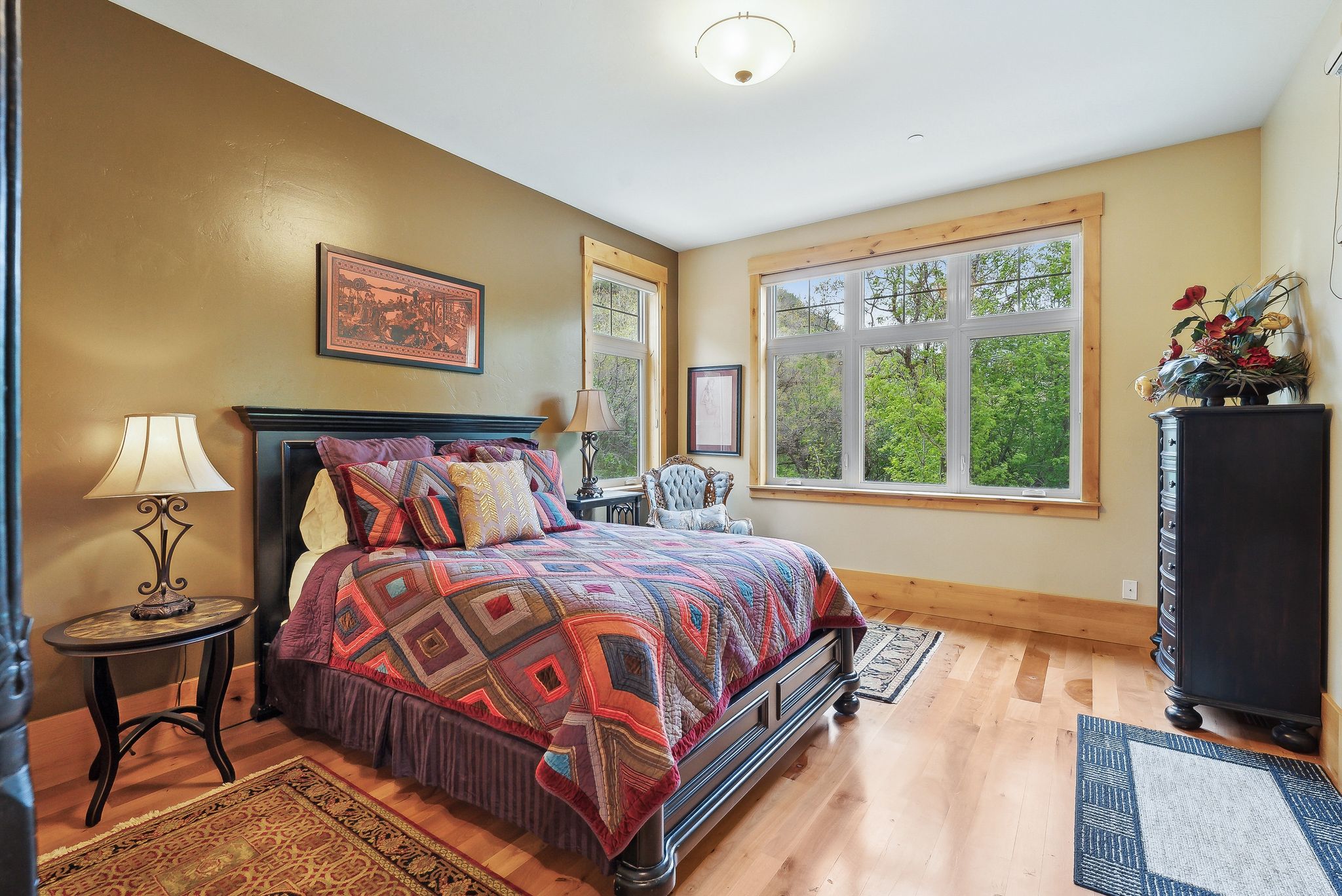 Bedroom featuring wood finished floors and baseboards