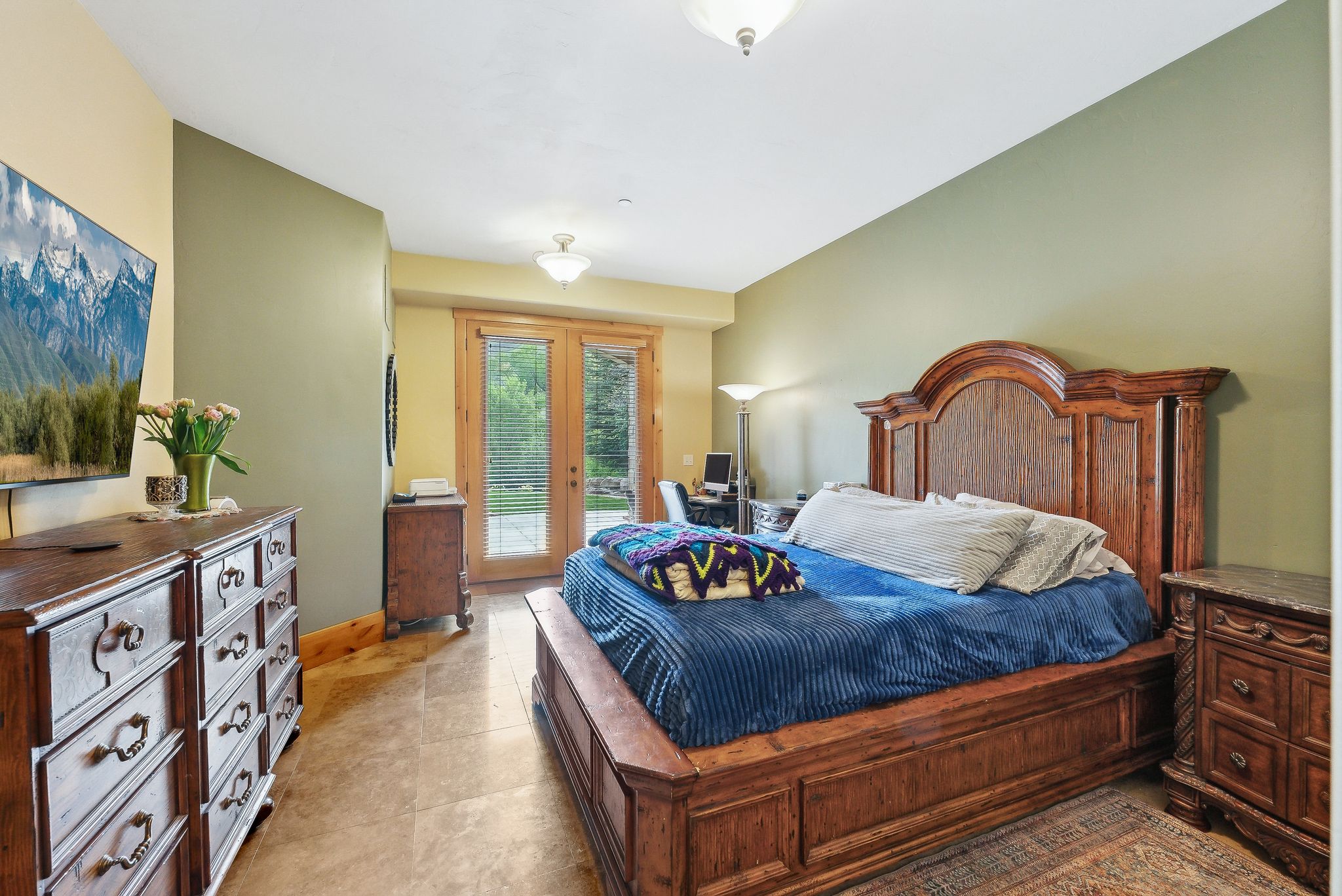 Bedroom with access to exterior, baseboards, and light tile patterned floors