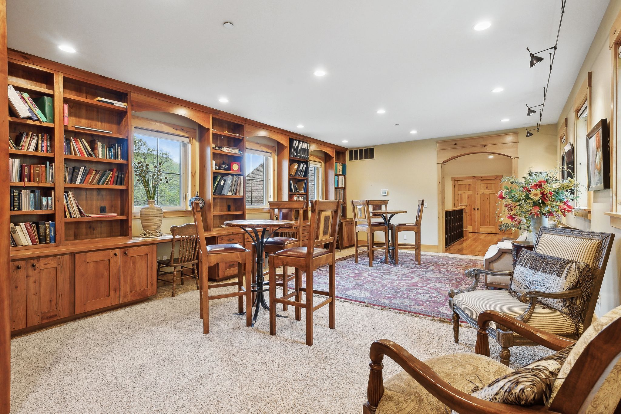 Dining space featuring light colored carpet and recessed lighting