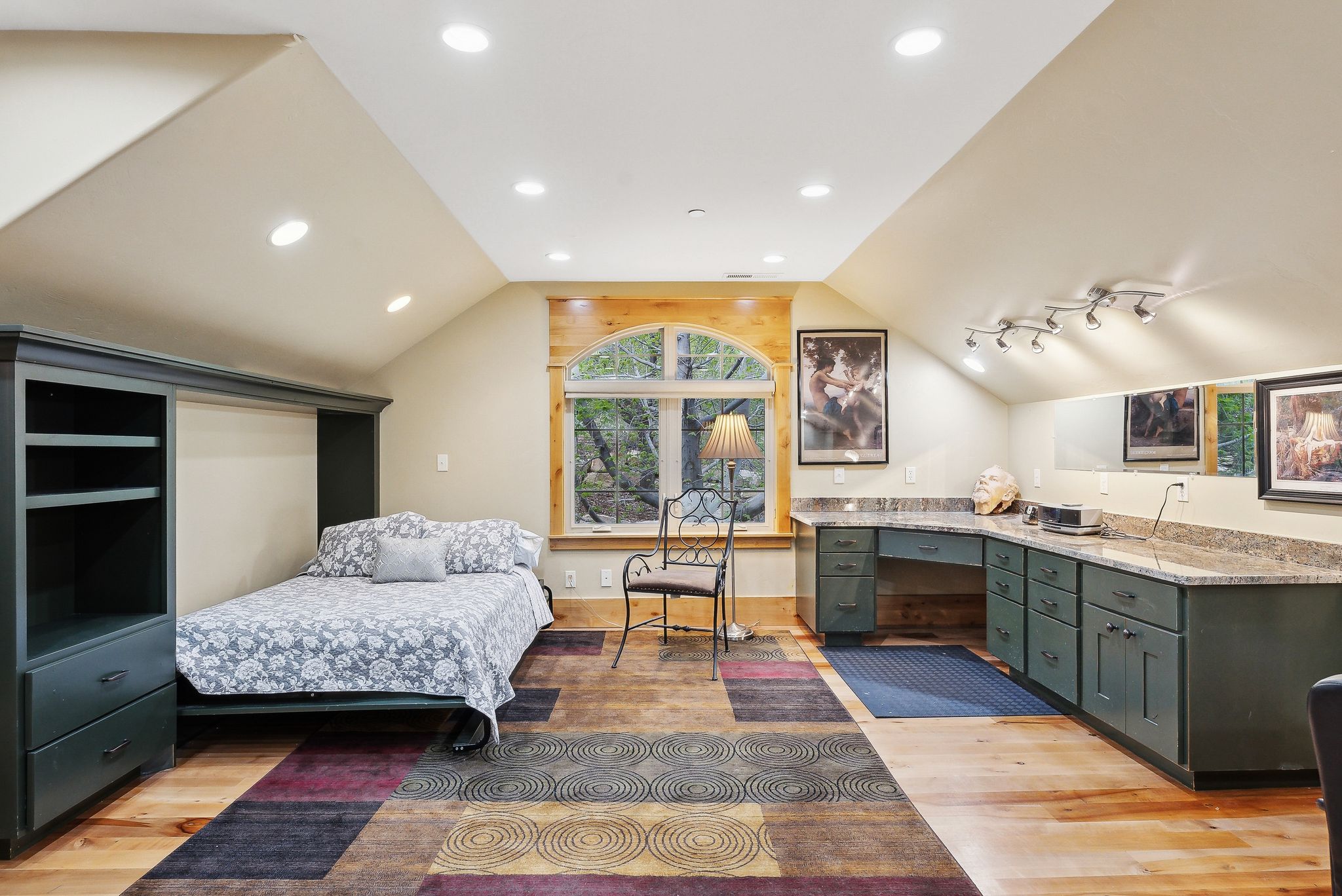 Bedroom featuring light wood finished floors, lofted ceiling, and recessed lighting