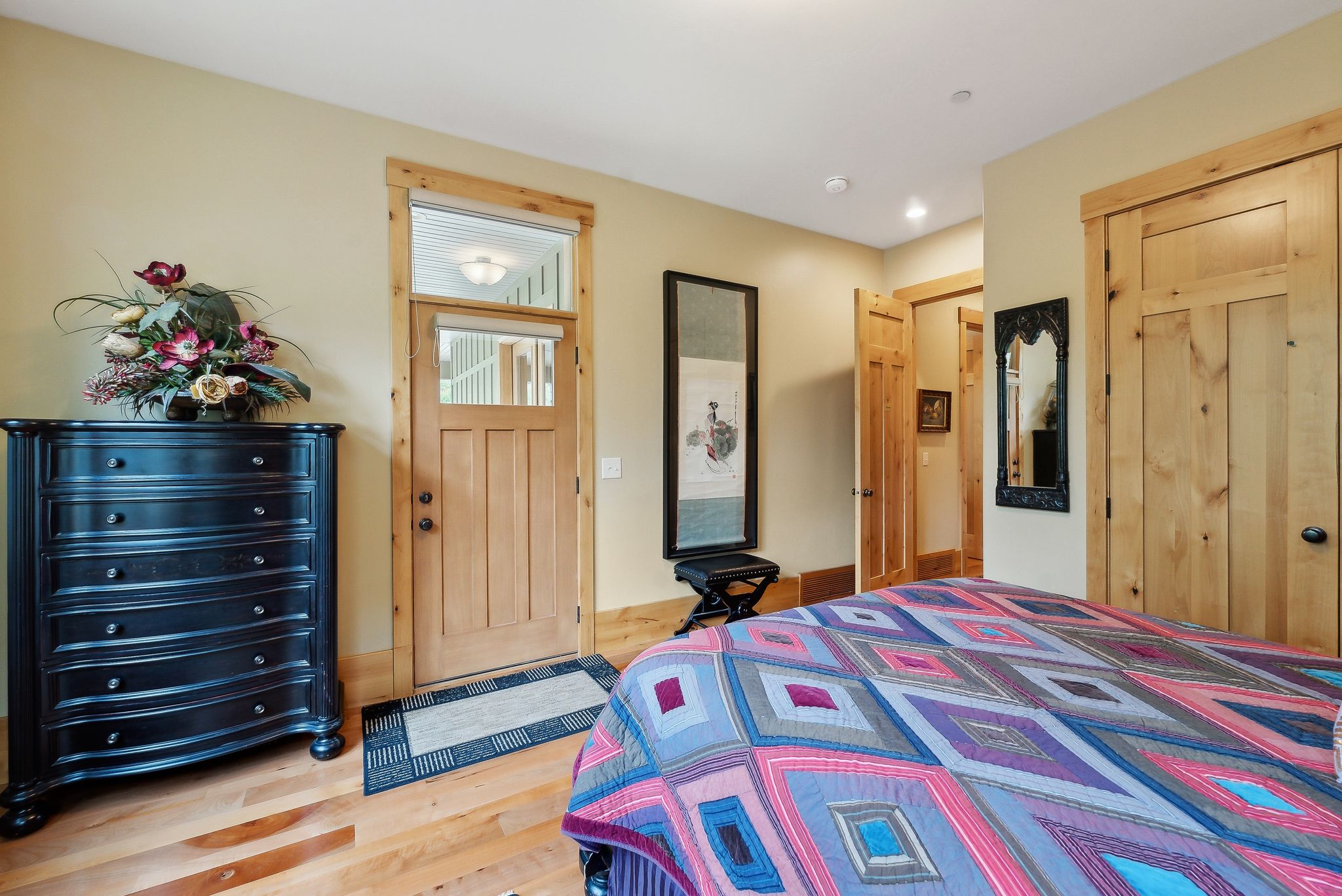 Bedroom featuring wood finished floors, a closet, and recessed lighting