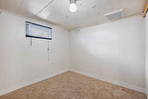 Unfurnished room featuring baseboards