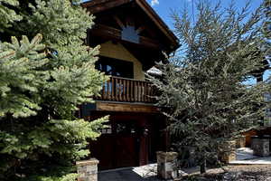 View of front of property with a balcony