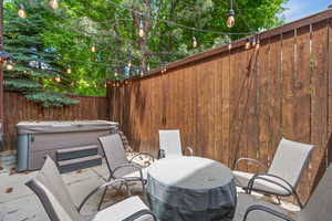View of patio featuring a hot tub
