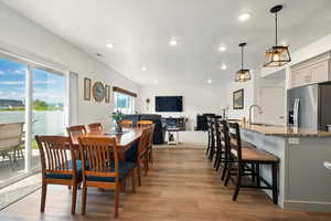 Dining room featuring recessed lighting and wood finished floors