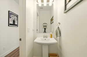 Bathroom featuring wood finished floors and baseboards
