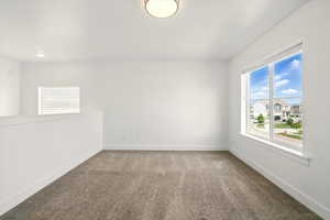 Spare room with carpet flooring and baseboards