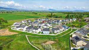 Aerial perspective of suburban area featuring a mountainous background
