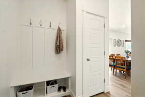 Mudroom with light wood-style floors