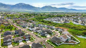 Aerial perspective of suburban area with a mountainous background