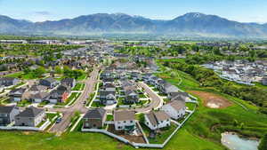 Aerial perspective of suburban area featuring a mountainous background