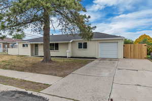 Ranch-style house with an attached garage and driveway