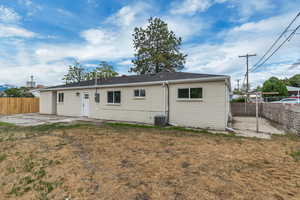Rear view of house with a patio and central AC unit