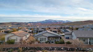 View of mountain background featuring nearby suburban area