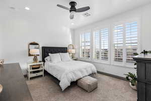 Bedroom with carpet floors, baseboards, a ceiling fan, and recessed lighting
