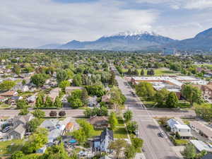 Aerial view of residential area featuring a mountainous background