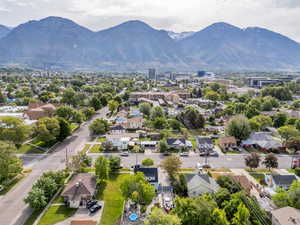 Aerial perspective of suburban area featuring a mountain backdrop