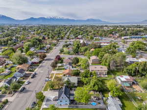 Aerial perspective of suburban area with a mountainous background
