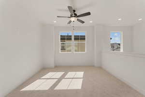 Empty room featuring carpet flooring, recessed lighting, a ceiling fan, and baseboards
