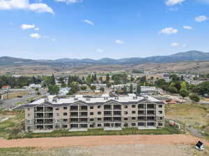 Aerial view of mountains and apartment complex / building