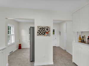 Hallway featuring baseboards