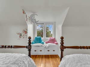 Bedroom featuring light wood-type flooring and baseboards