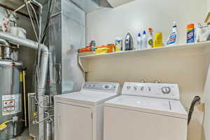Clothes washing area with washer and dryer and gas water heater