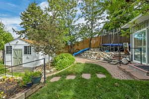 Fenced backyard with a trampoline