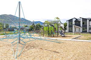 Community playground featuring a mountain view