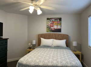 Bedroom featuring baseboards and a ceiling fan
