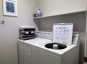 Laundry area with washing machine and clothes dryer