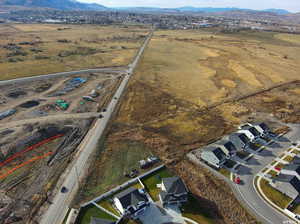 Aerial view of property's location with a mountain backdrop