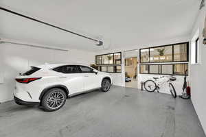Garage featuring a garage door opener