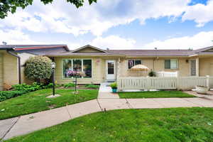 Ranch-style house with a shingled roof