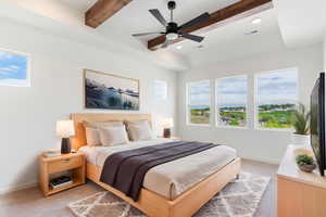Bedroom featuring light carpet, multiple windows, baseboards, recessed lighting, and beamed ceiling