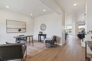 Living area featuring recessed lighting and light wood-style flooring